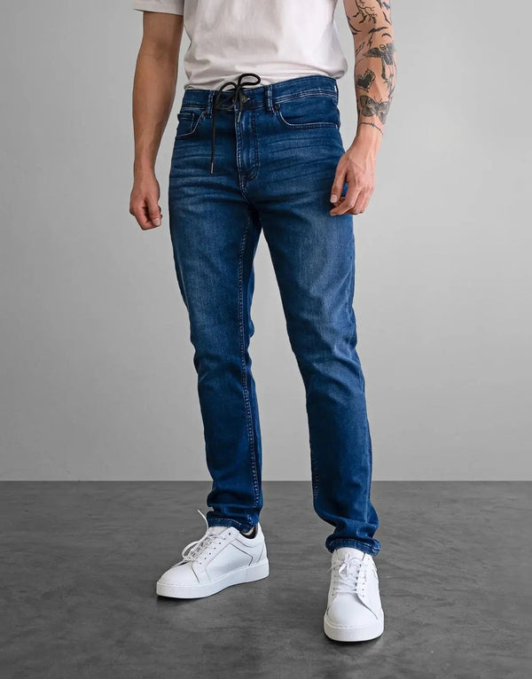 Fade Iconic Flow Blue Jeans: Slim Fit, Super Stretch Denim, Gel Pulse Pocket